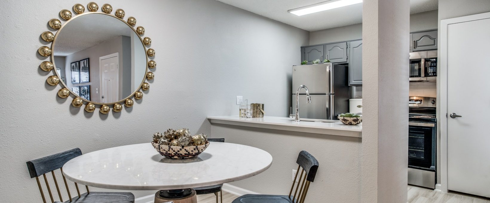 a dining room table and chairs in a kitchen at The Evaline