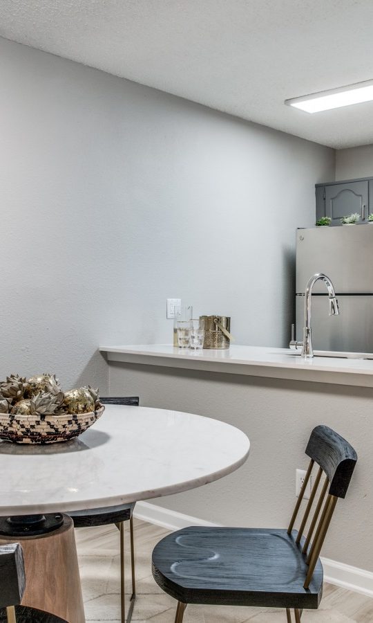 a dining room table and chairs in a kitchen at The Evaline