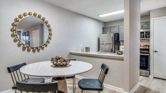 a dining room table and chairs in a kitchen at The Evaline