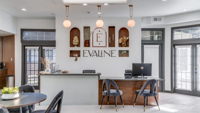 the lobby of the apartment building with a sign that says valine at The Evaline